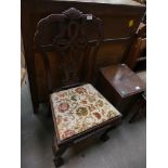 Four early 20th Century Chippendale style mahogany dining chairs.