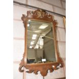 A Georgian style mahogany fretwork mirror.