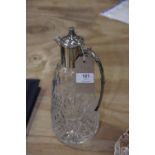 A plate mounted cut glass claret jug.