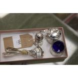 A Silver 3 piece cruet set, Birmingham 1925 and 6 assorted silver condiment spoons.