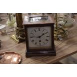 An early 20th Century mahogany cased mantle clock with a silvered dial and movement stamped '