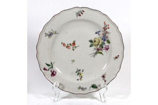 A mid 18th Century Chelsea polychrome plate Of circular form, painted with floral sprigs and sprays,