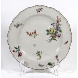 A mid 18th Century Chelsea polychrome plate Of circular form, painted with floral sprigs and sprays,