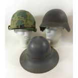 A collection of three military helmets, mid 20th Century and later To include American Infantry mans