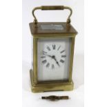 A 19th Century French brass carriage clock The enamel dial with Roman numerals, movement stamped R &