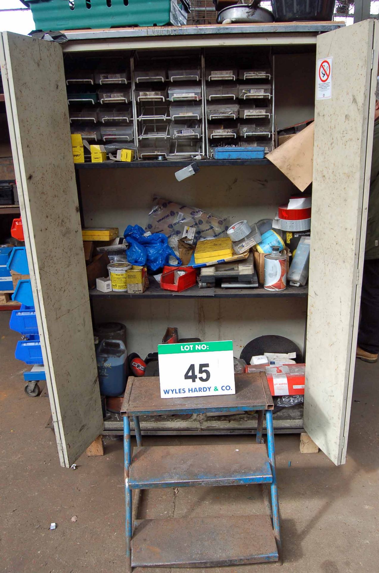 A Cream Steel 2-Door Cupboard with Contents comprising Various Nuts, Bolts, O-Rings, Rivets and A