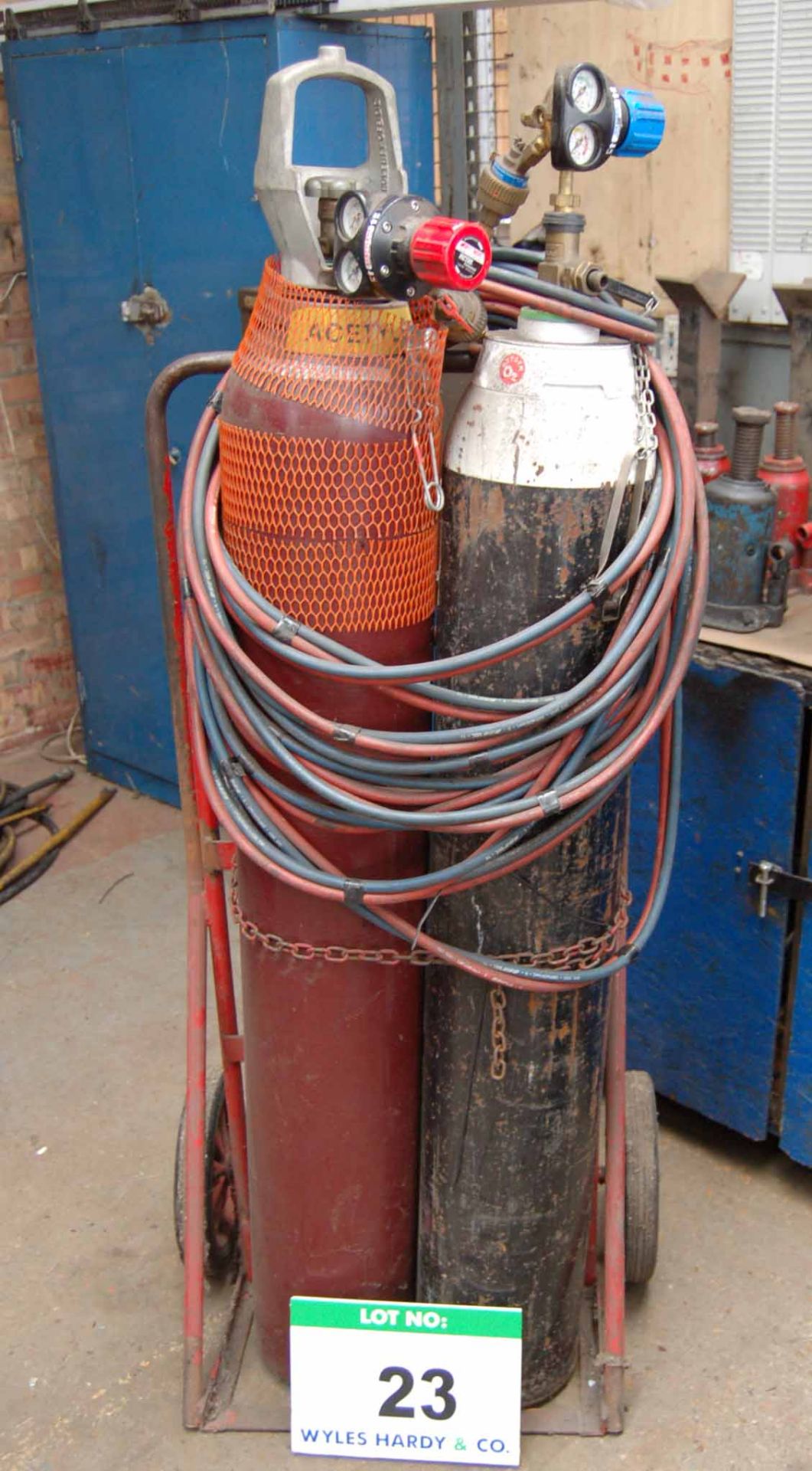 An Oxy-Acetylene Welding Set with Steel Twin Bottle Trolley Regulators, Hose and Lance (Bottles