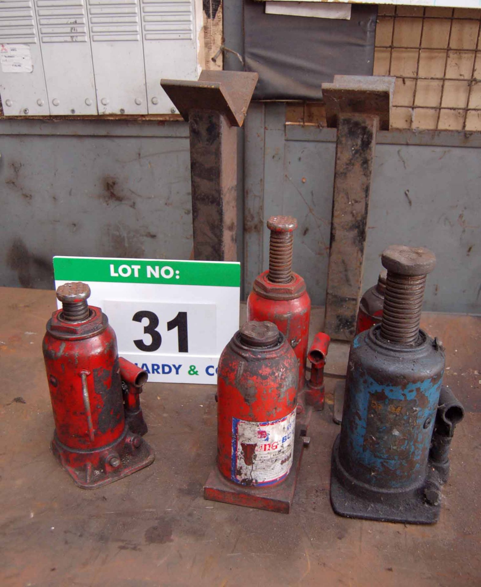 Five Various Hydraulic Bottle Jacks (No Crank Handles) and Two Various Mild Steel Stands