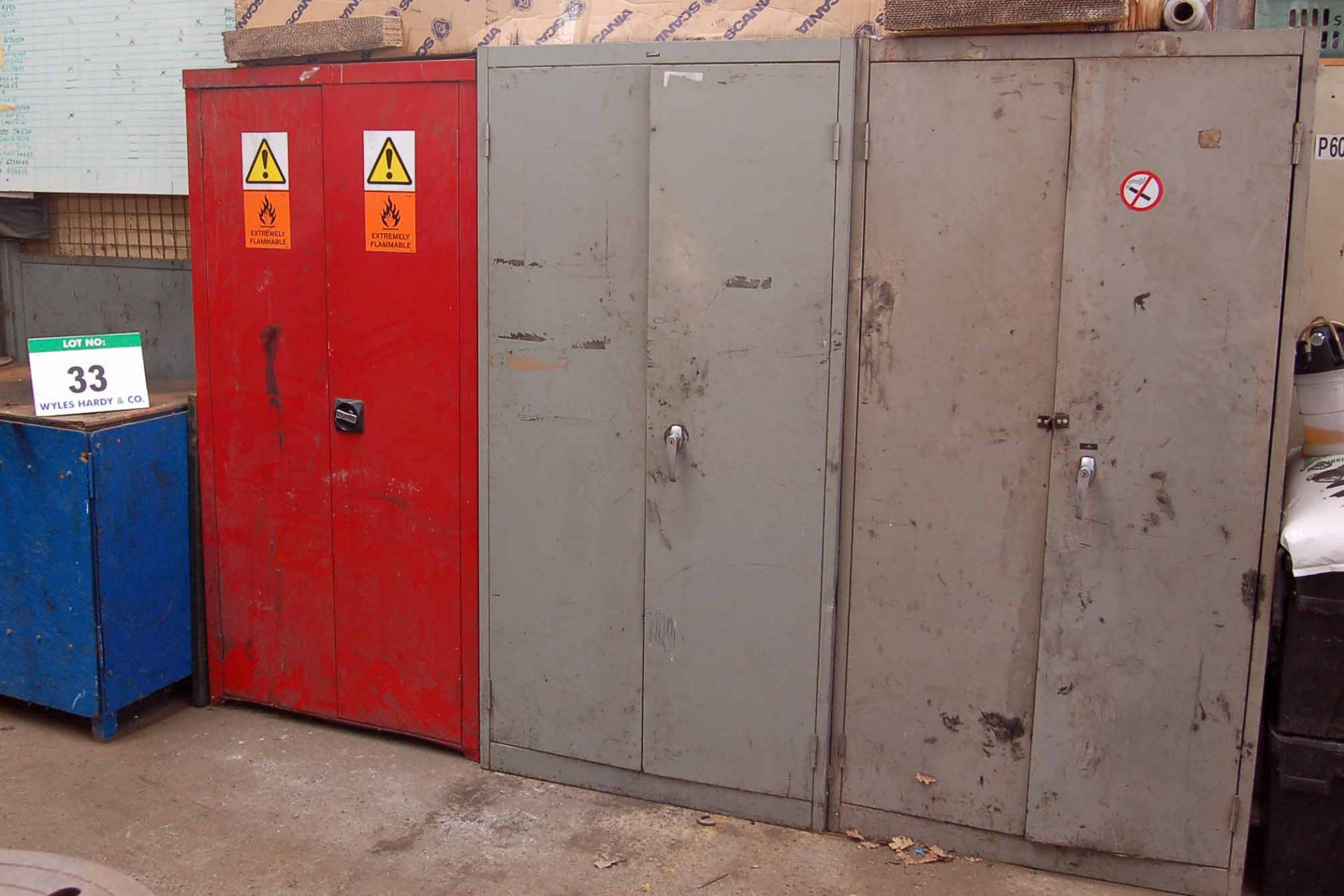 A Blue Steel 2-Door Cupboard, A Brown and Cream Steel 4-Drawer Filing Cabinet, A Timber Work Cabinet