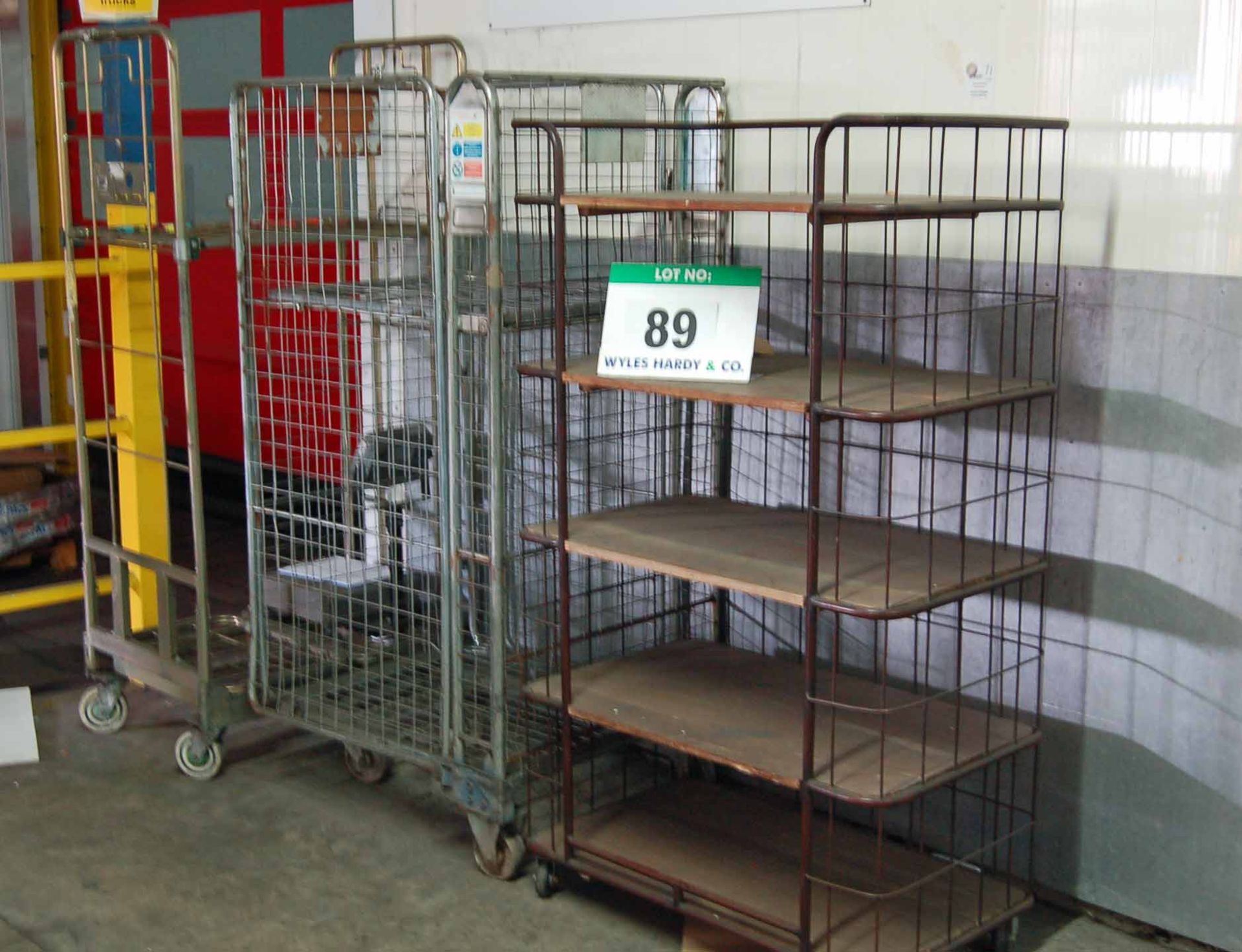 A 5-Tier Steel Wire Cage Trolley and Two Various Steel Wire Cage Trolleys