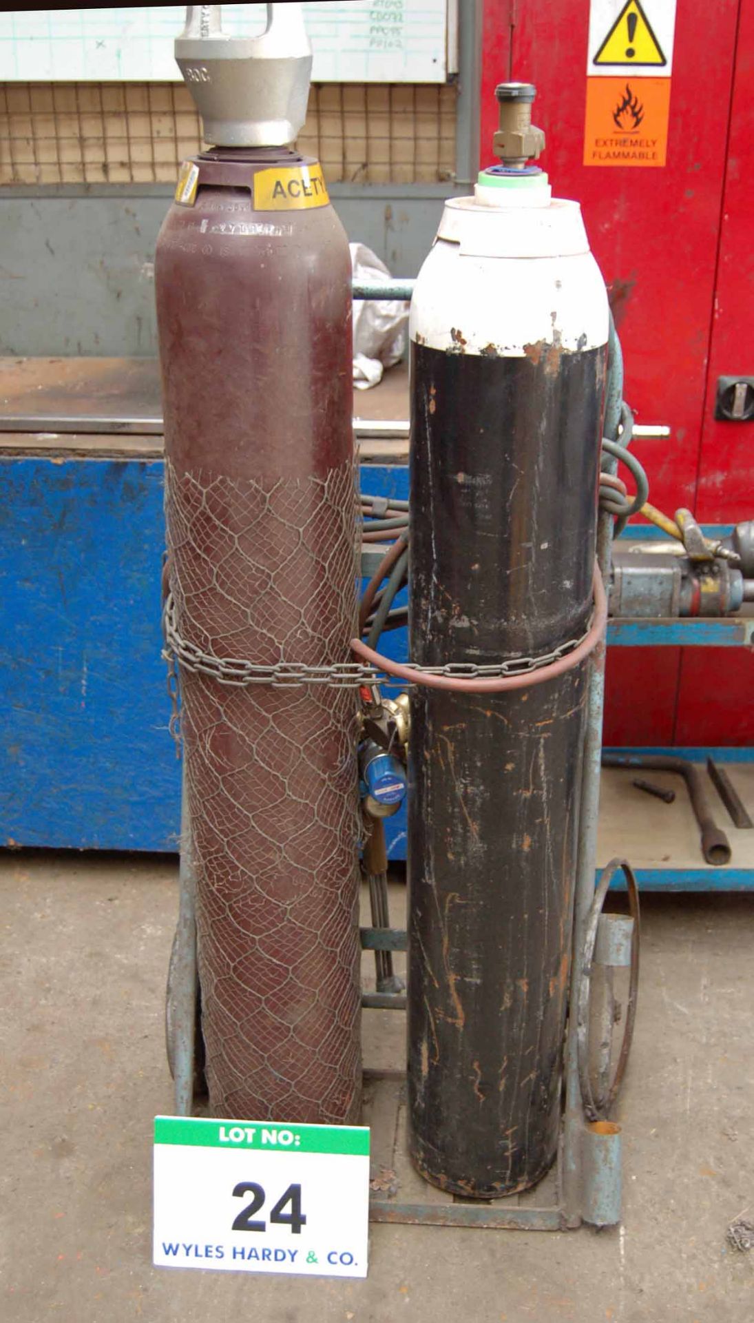 An Oxy-Acetylene Welding Set with Steel Twin Bottle Trolley Regulators, Hose and Lance (Bottles