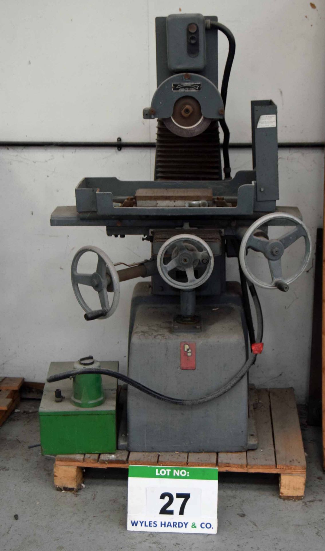 An EAGLE Horizontal Surface Grinder with 10 inch Magnetic Chuck and Cooling Pump (As Photographed)