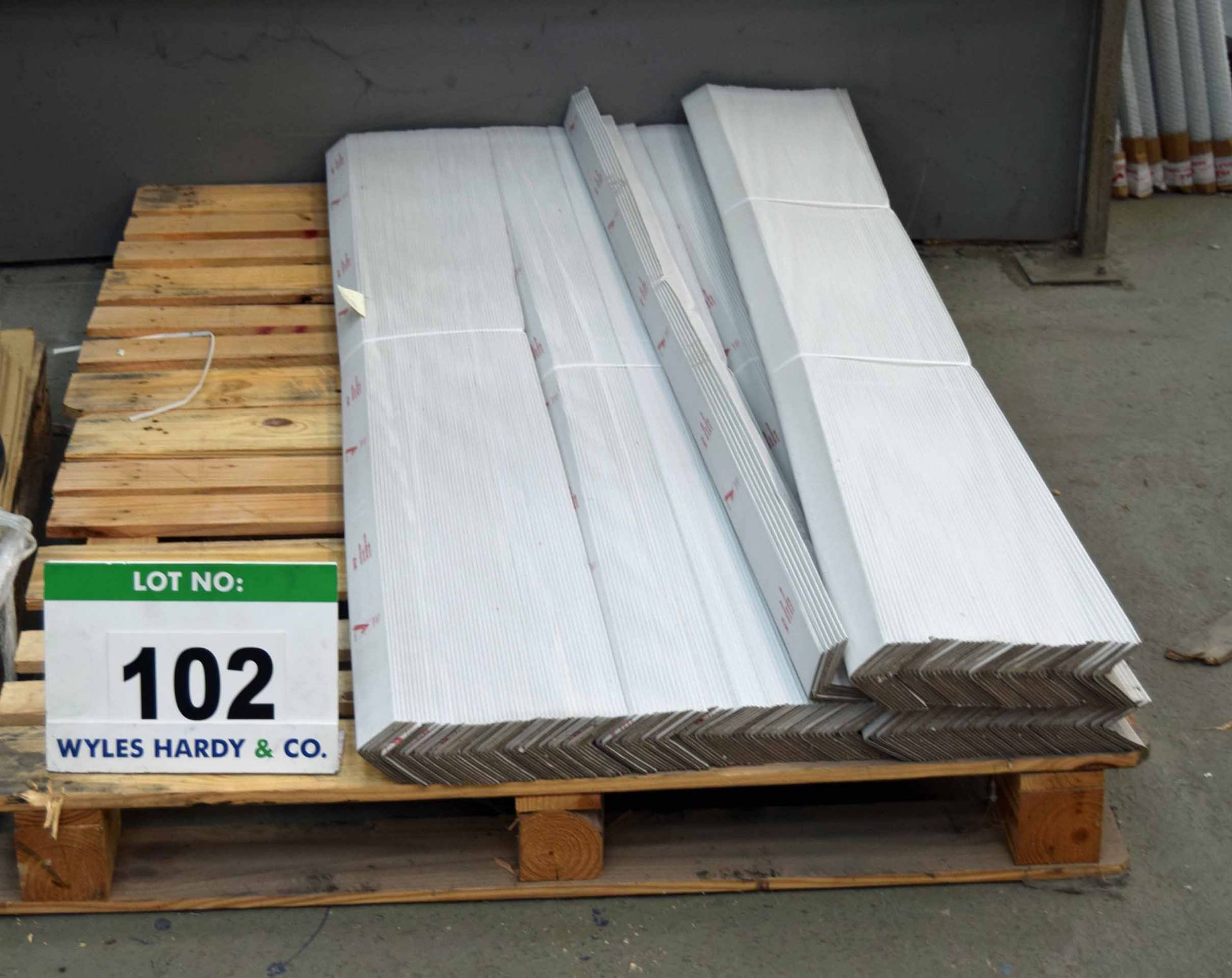 A Pallet of Protective Corners, Off-Cuts and A Packing Bench (As Photographed)