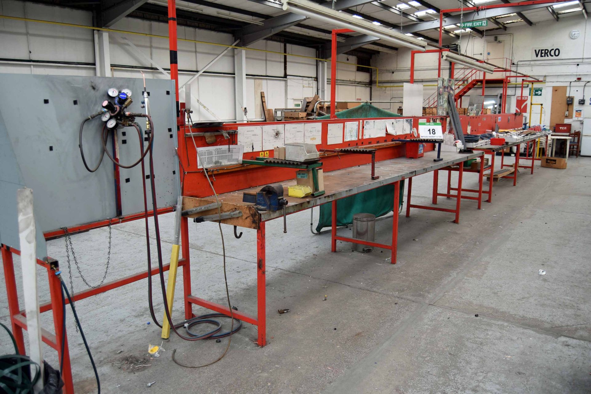 A Six Bay Welded Steel Assembly Bench with Overhead Gantry, fitted Vice and Gas Welding Solder