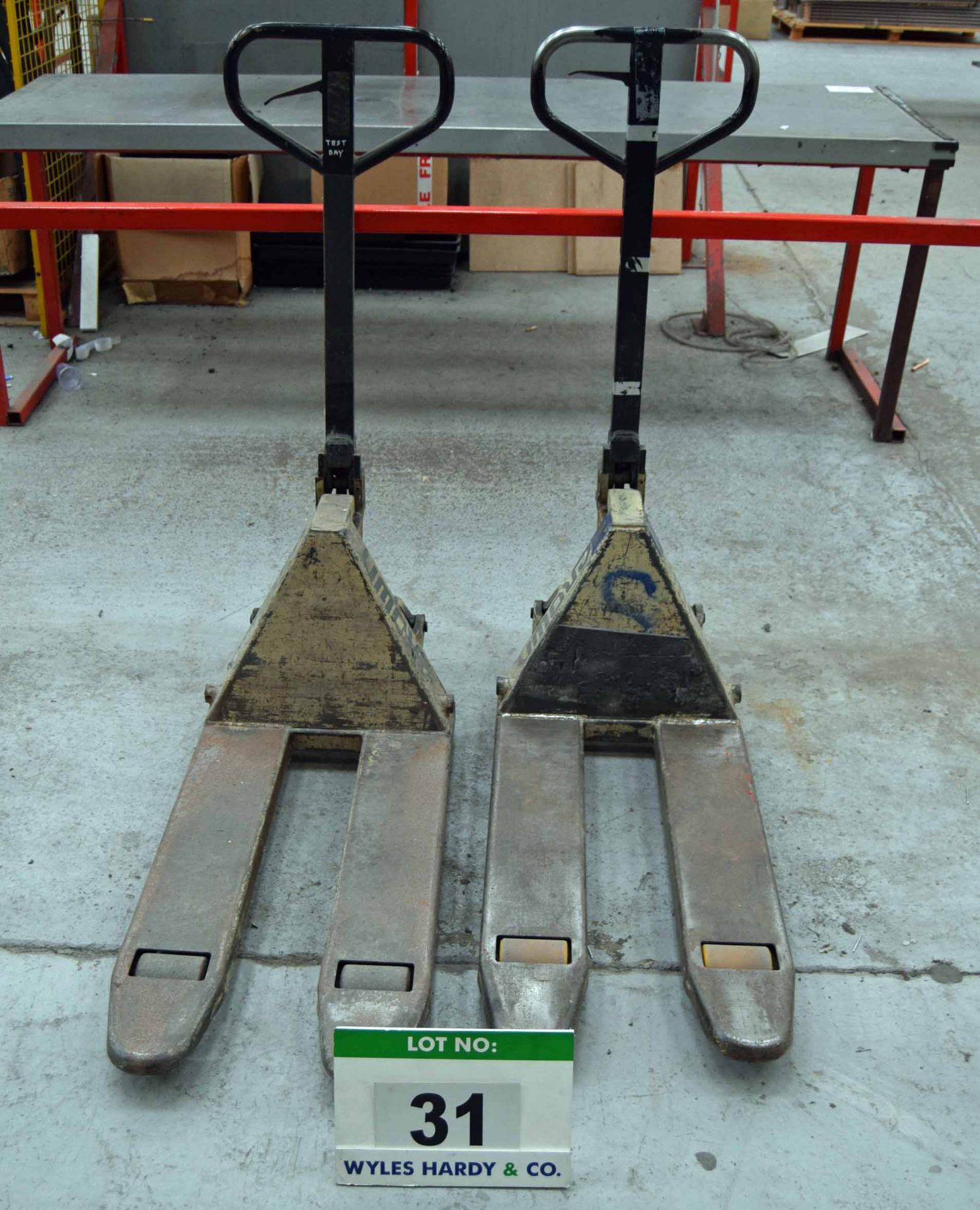 Two CROWN Compact Hydraulic Pallet Trucks