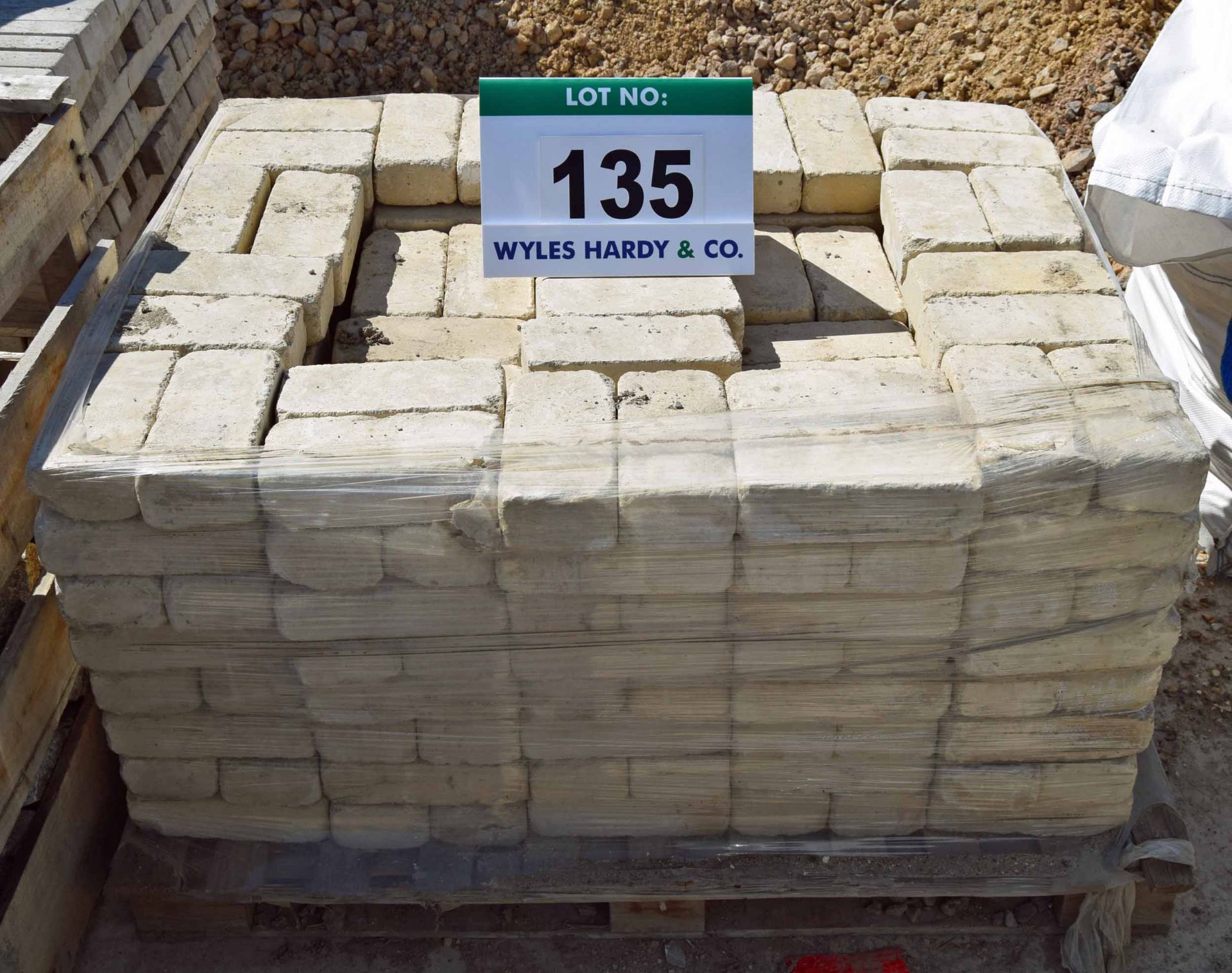 A Pallet containing Approx. Three Hundred Cream Coloured Bricks