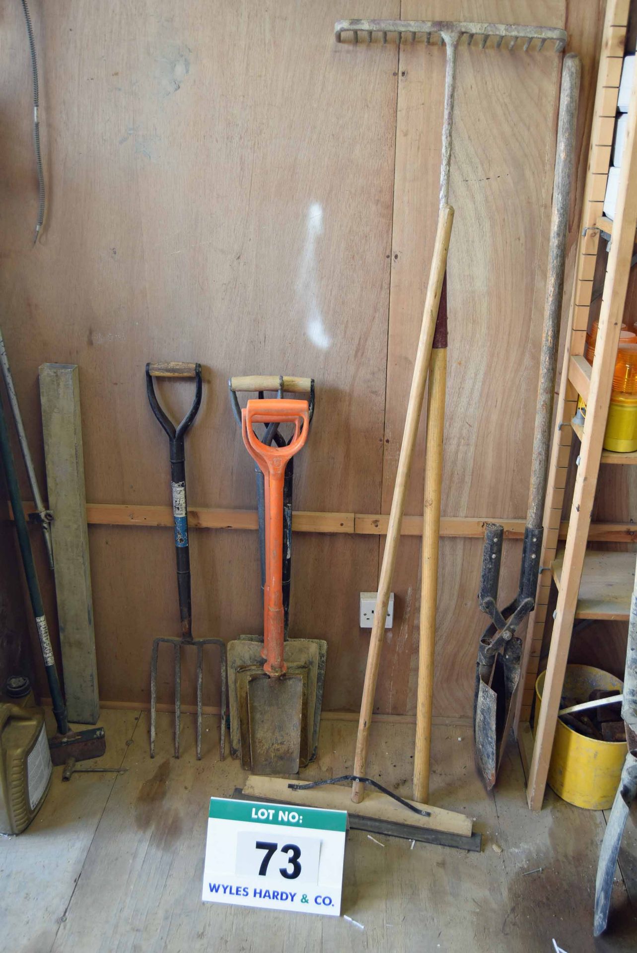 A Set of Groundworks Hand Tools including One 4-Tine Fork, Two Insulated Spades, Two Shovels, One