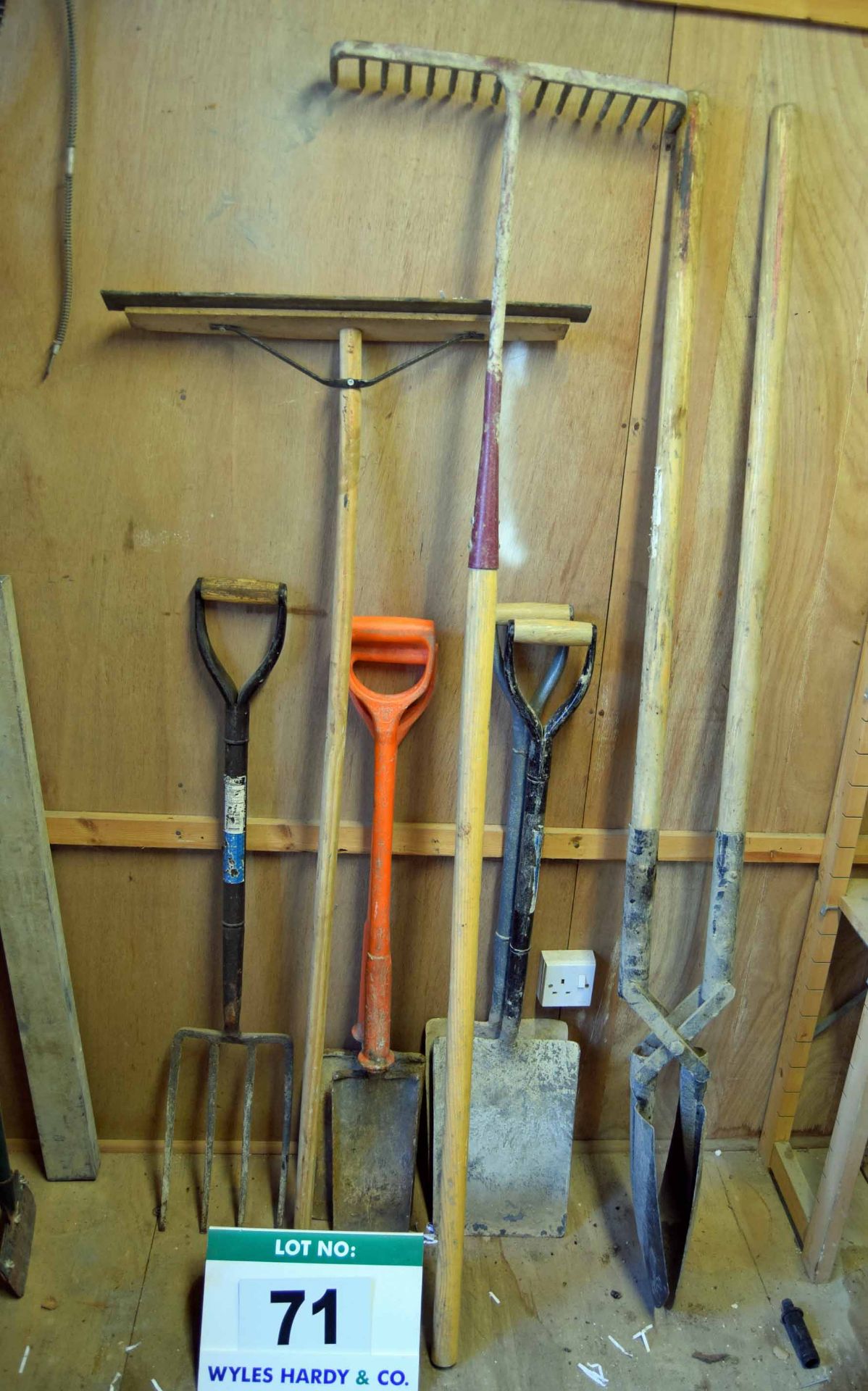 A Set of Groundworks Hand Tools including One 4-Tine Fork, Two Insulated Spades, Two Shovels, One