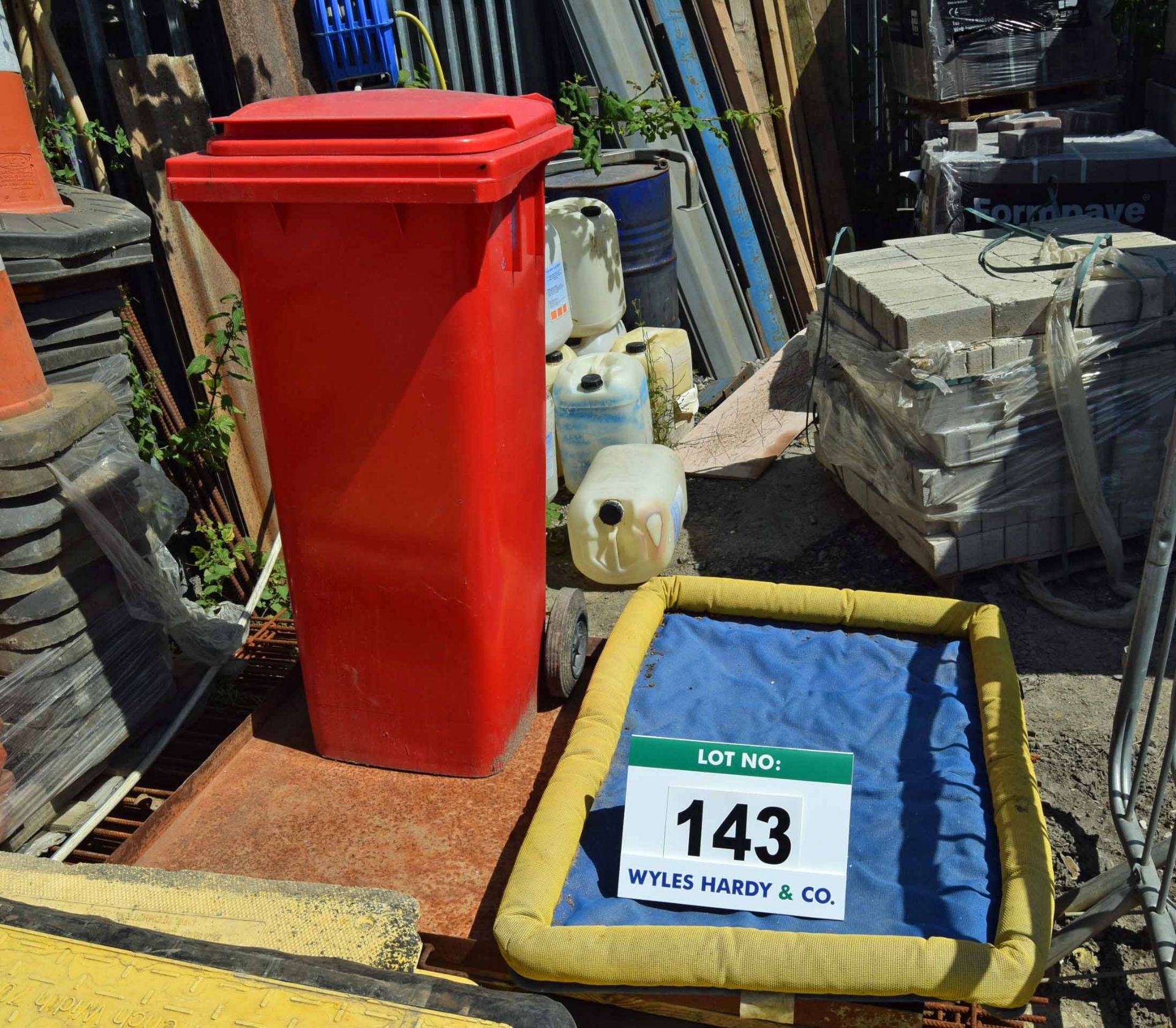 A Red Wheelie Bin containing Spill Kit and Three Drip Trays