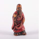 NETSUKE TOBOSAKU, Buchsbaum, das Gewand mit Negoro-Lackfassung, schöne glänzende Patina, akzentuiert