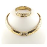 DEMI-PARURE, 750/ooo Gelbgold und Weißgold, bestehend aus Armband und Collier, besetzt mit