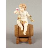 "PUTTO ALS HERBST" aus einer Gruppe, polychrom staffiert, H 12, best., min.rest., beigegeben