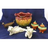 5 ceramic items including a pair of unmarked 20thC putti and a wade longboat etc All items appear in