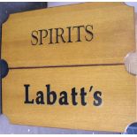 Pair of wooden bar signs, Labatts & Spirits Both signs measure 30 x 70cm.