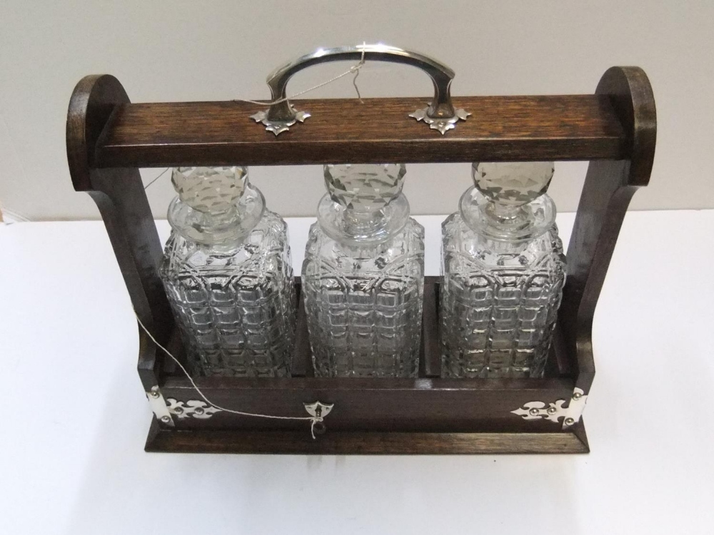 3 bottle antique, early 20thC tantalus complete with key 36 cm in length The bottles all have - Image 2 of 3