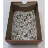 42 miniature bone china miniature bells, many with place names, Paignton, Brussels, Bridlington,