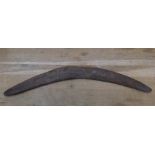 Early/mid 20thC hand cut Aboriginal boomerang with carved animal decoration 64cm in length