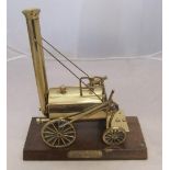 Brass model of Stephensons Rocket on wooden plinth 23 x 26 cm Fine