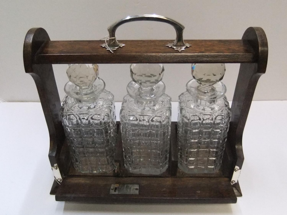 3 bottle antique, early 20thC tantalus complete with key 36 cm in length The bottles all have - Image 3 of 3