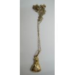 9ct yellow gold chain & pendant denoting a bag of money Approx 1.1 grams gross, 16" in length