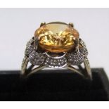 9ct yellow gold ring with large citrine surrounded by CZ Approx 6.3 grams gross, size P