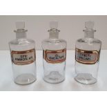 3 good quality antique clear glass chemist bottles Each bottle measures approx 21 cm high Each