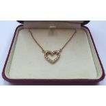 18ct gold Swiss necklace & chain with the integrated heart-shaped necklace sporting 16 diamonds. The