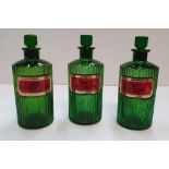 3 superb antique green glass chemist bottles Each bottle measures approx 21 cm high Each bottle &