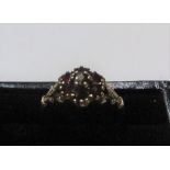 9ct yellow gold and 7 garnet stone ring Approx 1.3 grams gross, size J