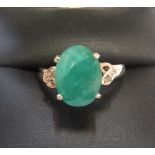 9ct yellow imported gold ring with a large oval Emerald & with 2 small diamonds to the shoulders