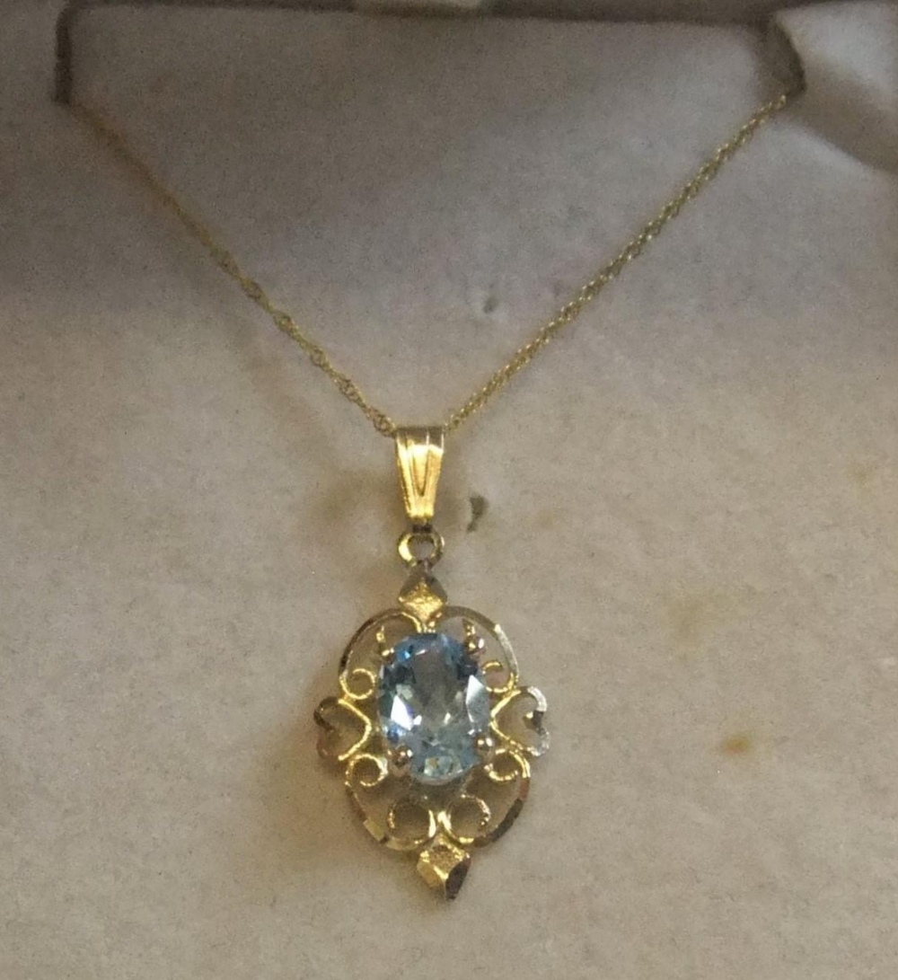 9ct yellow gold chain together with 9ct gold pendant with solitaire topaz Approx gross weight 1