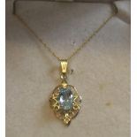 9ct yellow gold chain together with 9ct gold pendant with solitaire topaz Approx gross weight 1