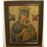 Old framed religious print depicting the Virgin Mary and baby Jesus and another large religious