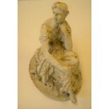 Victorian cast metal figurine of a seated frame, ,white painted 25 cm high