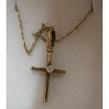 9ct yellow gold chain together with a 9ct yellow gold cross adourned with a small central diamond