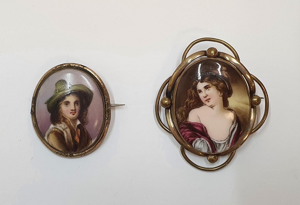 2 hand painted antique brooches on ceramic