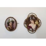 2 hand painted antique brooches on ceramic