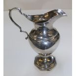 Antique 1919 silver cream jug in classical form 13 cm high, 70 grams