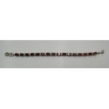 Silver bracelet with red stone panels, 20cms long