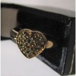 9ct yellow gold, heart shapped ring filled with green stones (probably peridots) Approx 2.2 grams